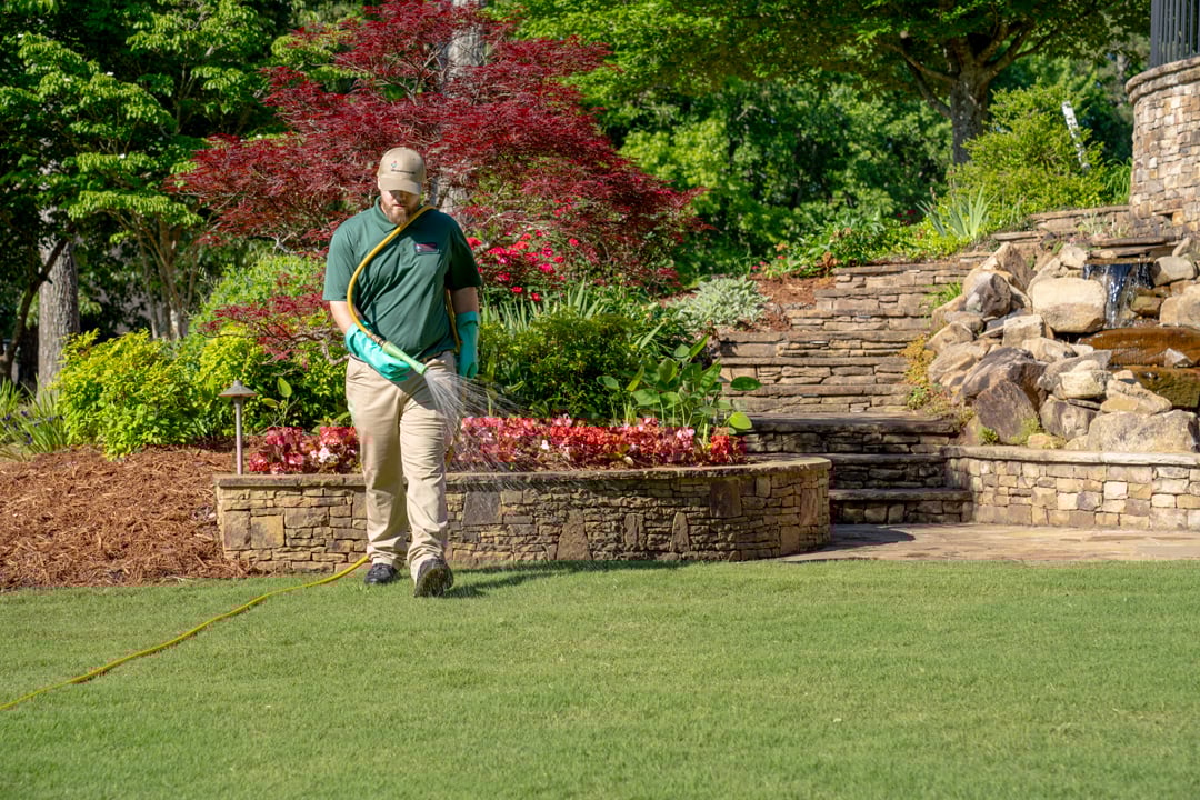 Turf Doctor Winthrop Maine lawn care and pest control treatment in backyard