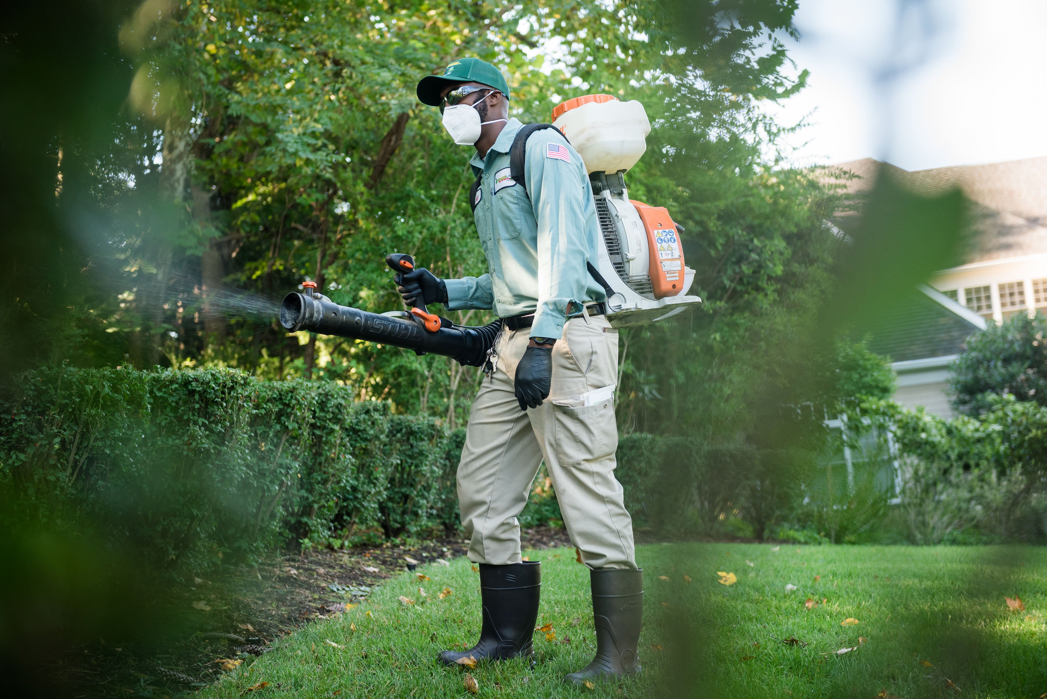 manchester turf doctor technician applying mosquito control