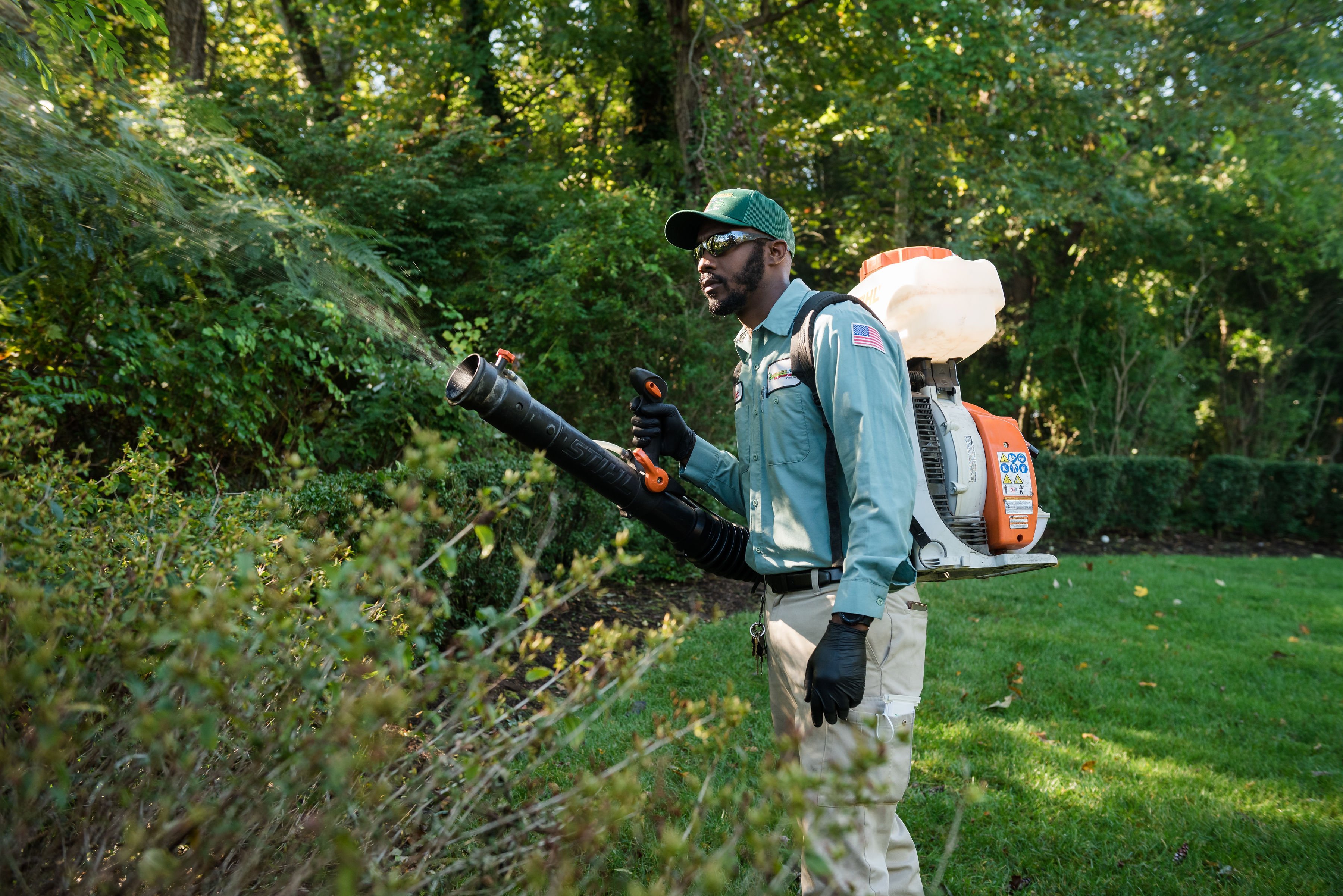 turf doctor belgrade technician applying mosquito control