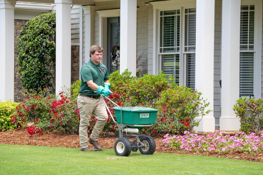 turf doctor hallowell lawn tech applying weed control to lawn