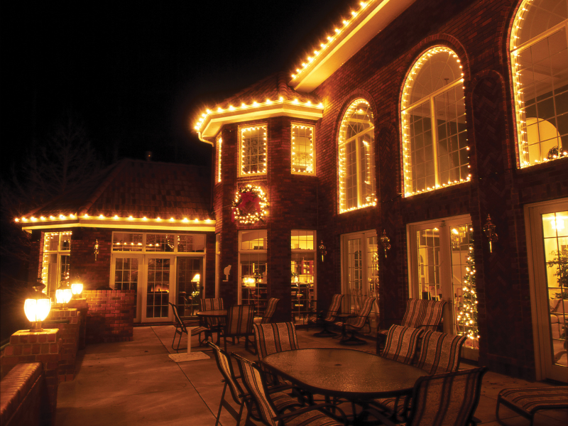 Residential roofline and entryway holiday lighting
